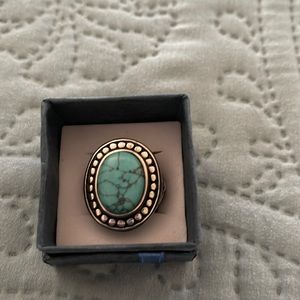 Beautiful turquoise and silver ring. Approximately one inch.